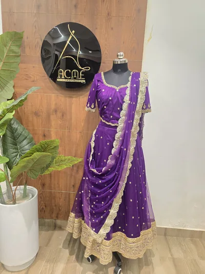 Purple lehenga on a mannequin at the ACME studio